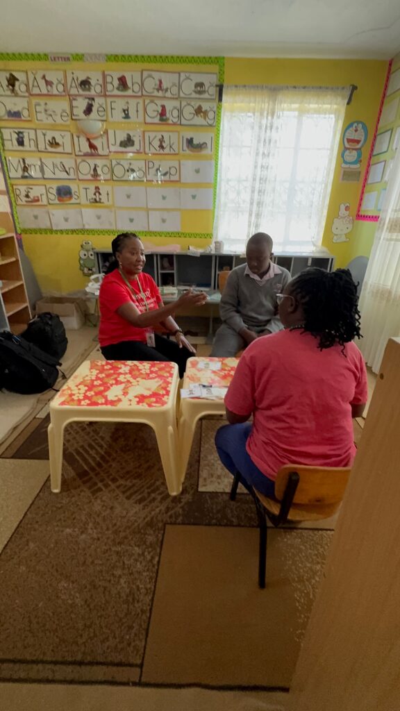 SLP working with the therapy aide in a session